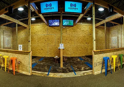 Chopper's caged axe throwing arena with targets