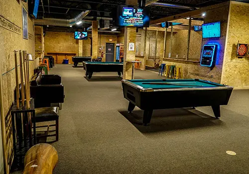The Chopper's entertainment lounge with games and TVs