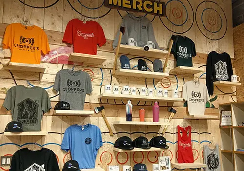 Chopper's pro shop with axes and branded swag